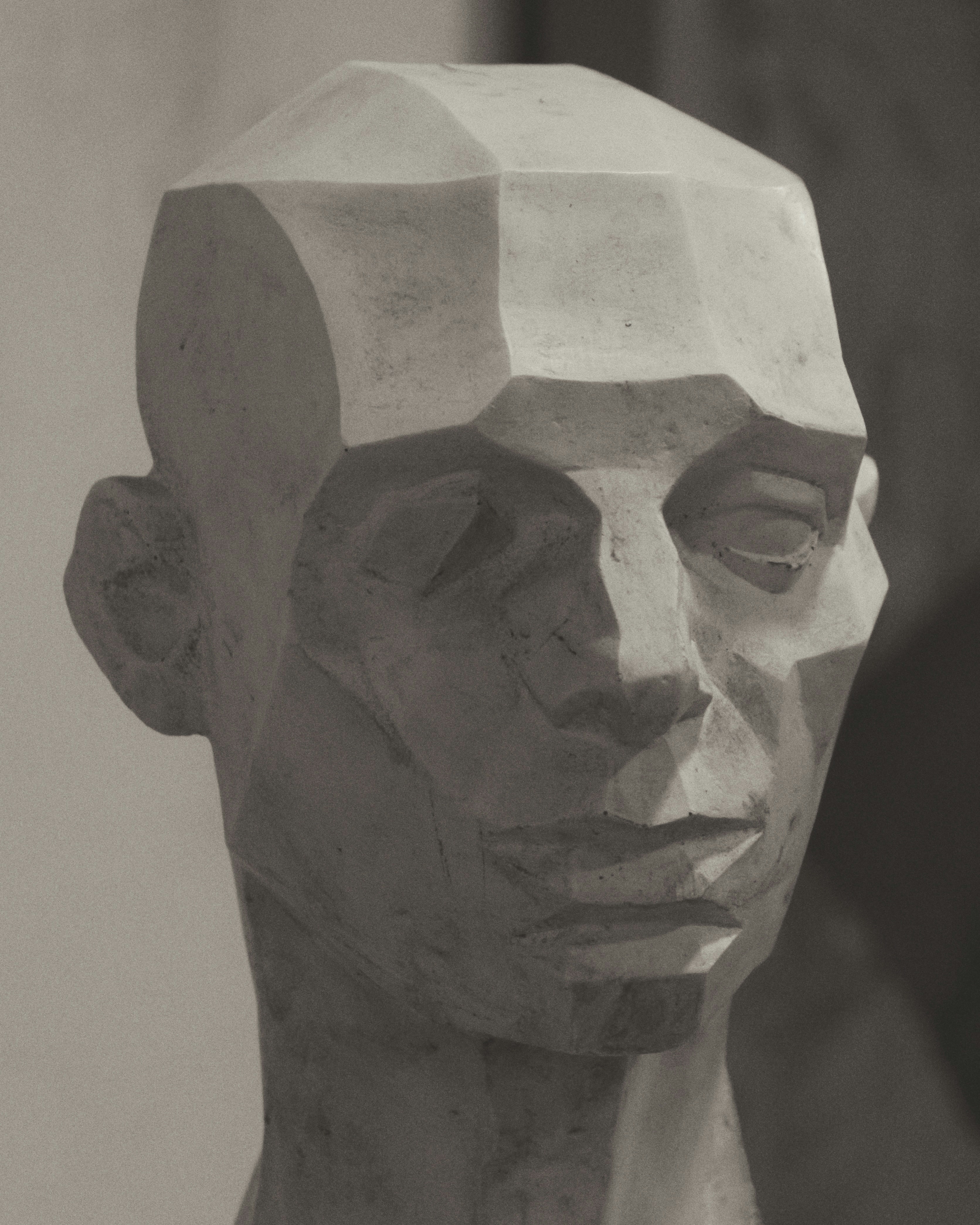 Carved stone bust sculpture